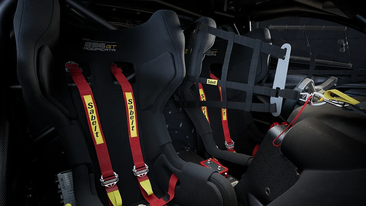 Interior cabin and racing bucket seats with red Sabelt harnesses of the Ferrari 296 GT Modificata