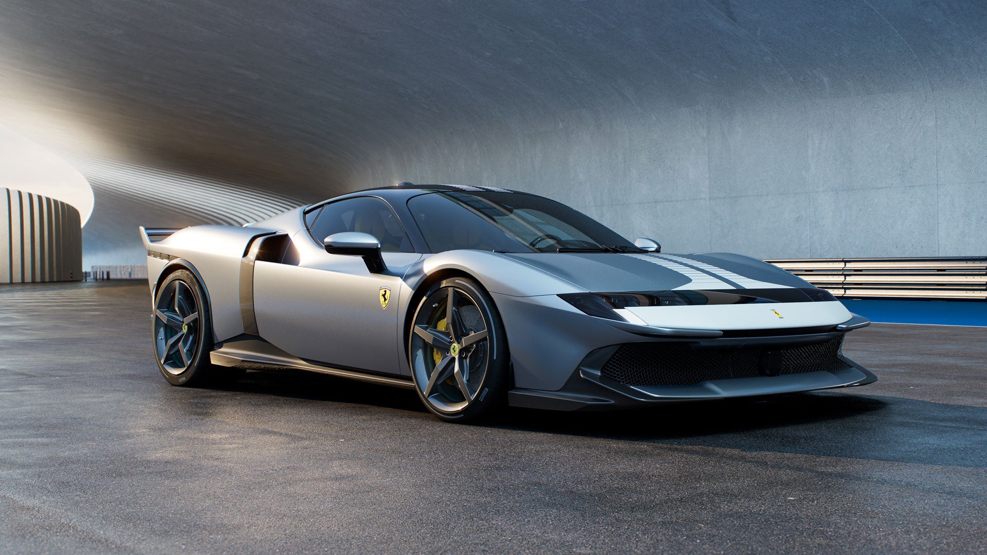 A sleek, silver Ferrari Vision Gran Turismo with a black and white racing stripe, parked in a modern, concrete tunnel.