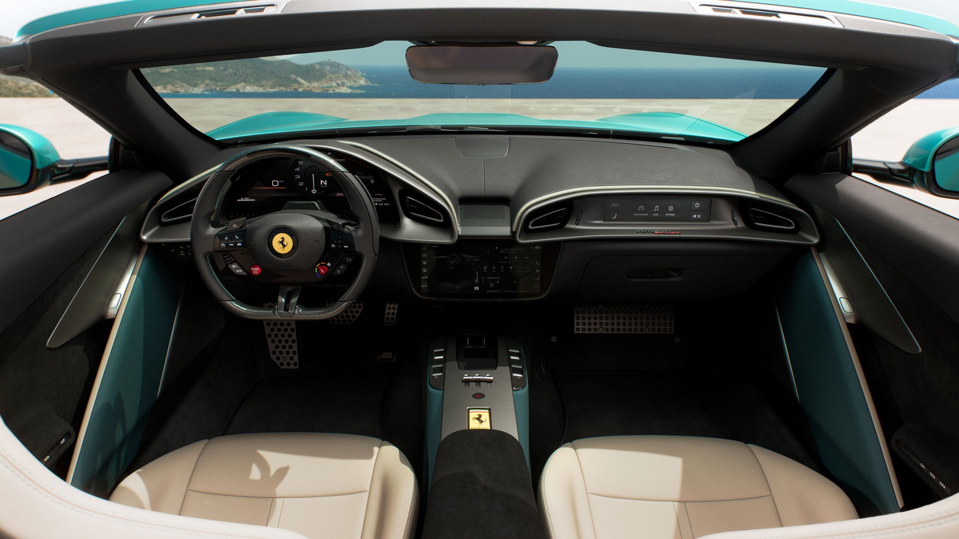 Overhead view of a Ferrari interior with black and blue trim. Two blue racing seats separated by a central console are visible.