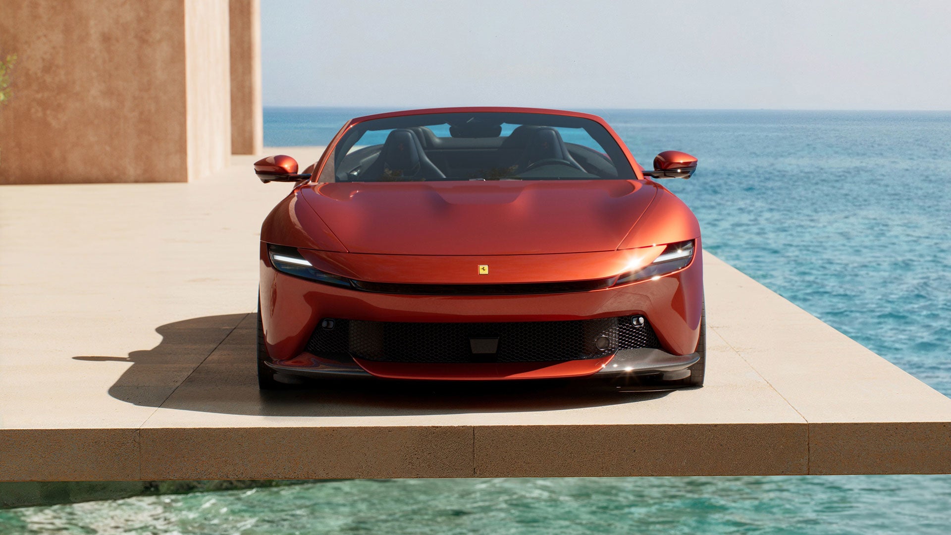 Rear view of a red Ferrari B49 Testarossa with a black roof and rear window, showing two tailpipes, on asphalt.